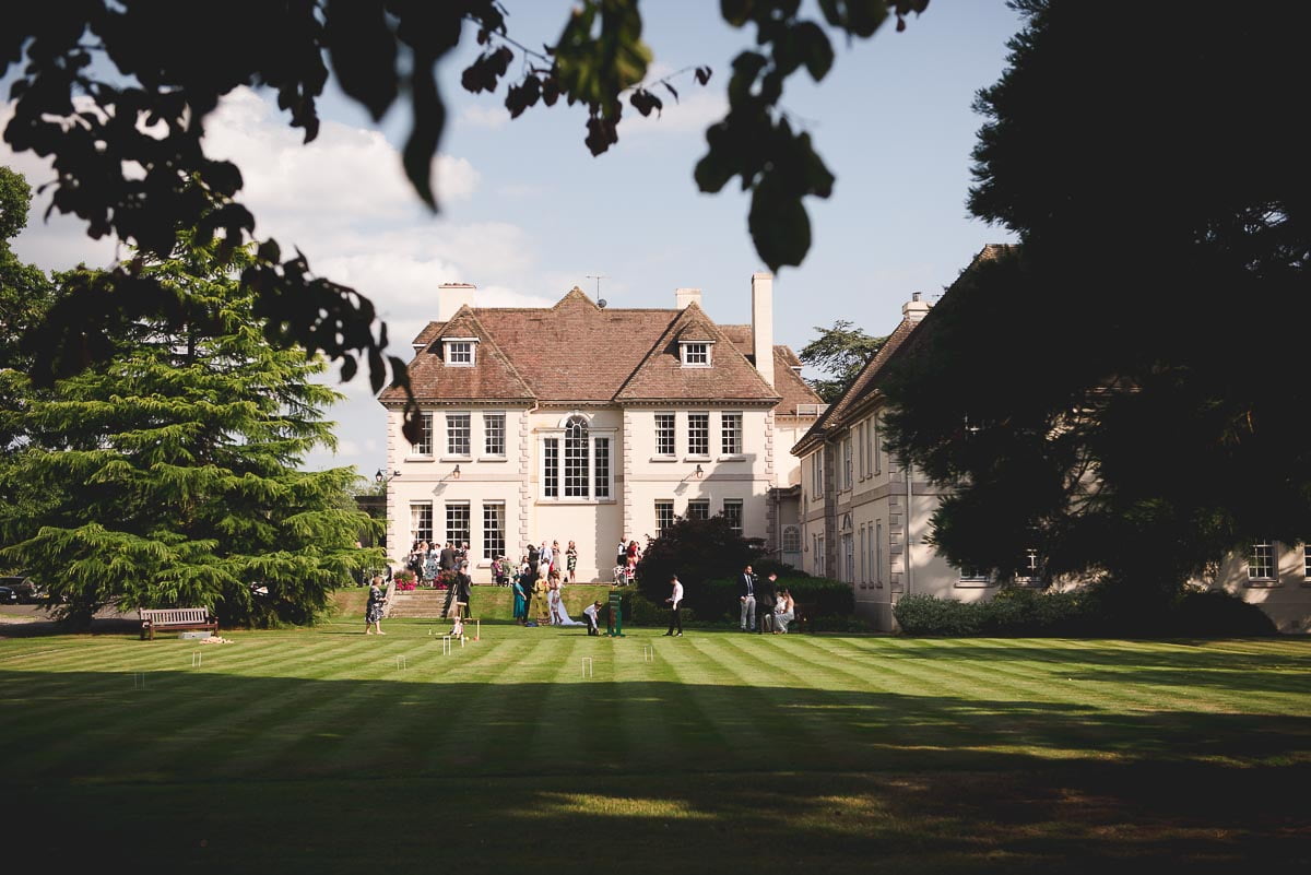 Looking across the parkland towards Brockencote Hall wedding